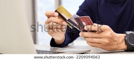 Businessman holding credit card for online shopping bill on smartphone, positive man shopping online remote payment , smart payment concept individual bank Royalty-Free Stock Photo #2209094063