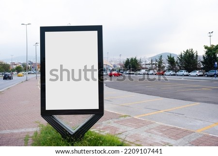 Mockup of a blank vertical empty white advertisement urban billboard on the roadside in the city with copy space, blank frame mockup in Istanbul, perspective angle Royalty-Free Stock Photo #2209107441