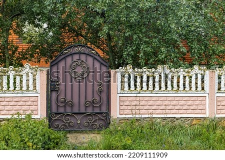 fence with a gate in the Partuguese style. decorative fencing