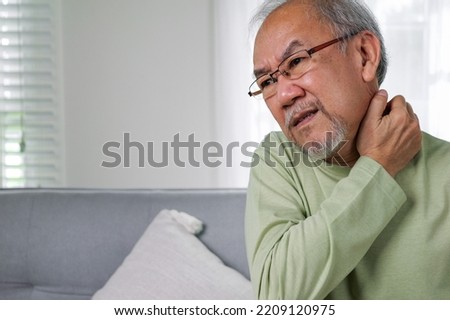 Senior pain shoulder, Pain in the shoulder, elderly with office syndrome or work-related musculoskeletal disorder, senior pain from working. Royalty-Free Stock Photo #2209120975
