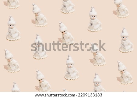Merry Christmas and happy New Year greeting card with copy-space. Seamless pattern with snowmen on pastel beige background. Winter holidays concept.