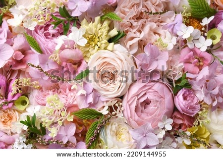 Delicate blooming festive light pink roses and bright flowers, blossoming rose flower background, bouquet floral card, selective focus, shallow DOF