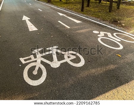 Bicycle sign on road in the park.