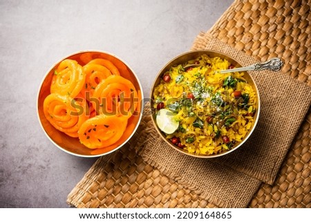 Aloo Poha with Jalebi, snack combination also called imarti and kande pohe Royalty-Free Stock Photo #2209164865