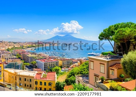 Naples, Italy. View of the Gulf of Naples from the Posillipo hill with Mount Vesuvius far in the background and some pine trees in foreground. August 31, 2021.  Royalty-Free Stock Photo #2209177981
