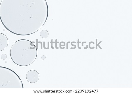 Gel texture. On a white background. Transparent gel. Drops, trailing, medicine, fertilization, research, laboratory, cosmetic gel, medical gel