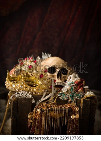 Romantic image of a treasure chest filled with jewellery, precious gems and golden king's crowns