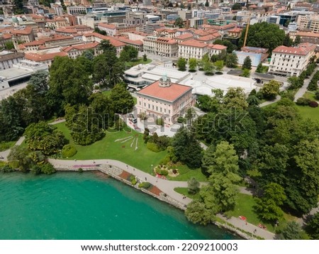 Ciani Park in the South switzerland in the summer of Ticino during the pandemic and the green lake next to the green trees and the houses Royalty-Free Stock Photo #2209210003