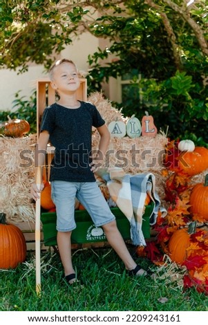 boy with pumpkin, golden autumn