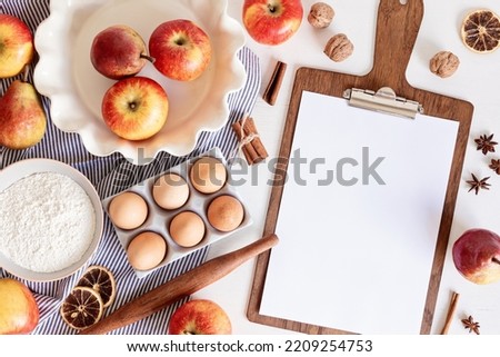 Fall pie baking ingredients with apples, pears, nuts, seasonal spices and tools. Apple pie recipe idea. Thanksgiving and autumn holidays celebration concept