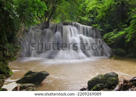 landscape photo of beautiful waterfall in green forest