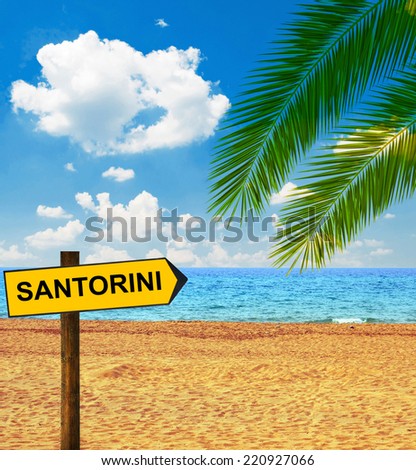 Tropical beach and direction board saying SANTORINI