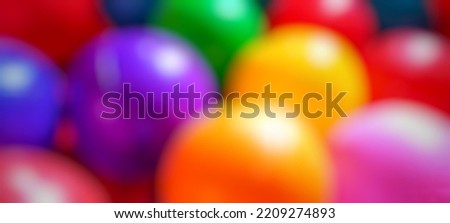 Defocused abstract background of colorful balls children's toys