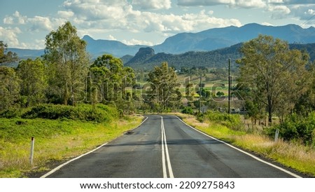 Picturesque road in rural Queensland going towards the Scenic Rim, Australia Royalty-Free Stock Photo #2209275843