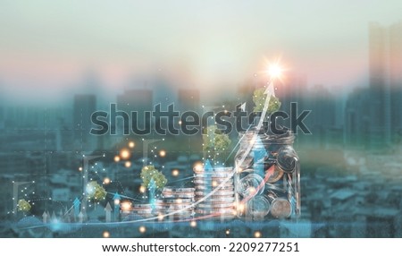Increasing the value of tree planting capital with coins Finance and investment. Diagram. Finance and banking business concept. Savings for a coin-growing business city background are popular. Royalty-Free Stock Photo #2209277251