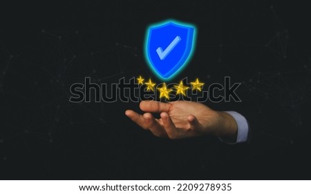 Businessman hand showing digital technology icon sign with a check mark. The best quality assurance service concept. Product performance assurance and industry-leading ISO certification