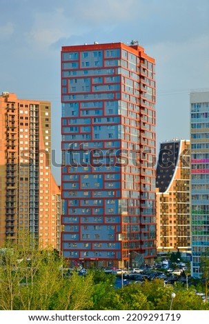Novosibirsk, Siberia, Russia, 08.20.2022. A new area of the city. Multi-colored multi-storey residential buildings