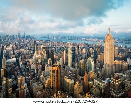 Manhattan skyscrapers at sunrise. Aerial skyline view of New York City towards lower Manhattan