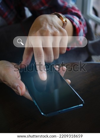 hand holding a smartphone to use the search bar find information data and more on the internet