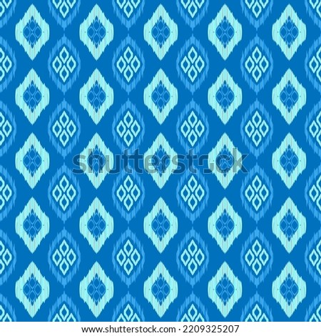 Ikat seamless pattern blue gradation color background. African mayan ethnic diamond shape line fabric seamless patterns. Design for textile, wallpaper, clothing, backdrop. Vector retro vintage style.