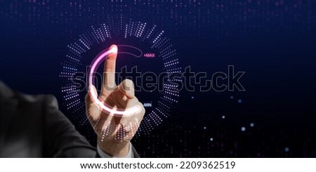 Close up of businessman hand pointing at abstract glowing max and min scale hologram on wide dark background with mock up place. Volume control and future concept Royalty-Free Stock Photo #2209362519