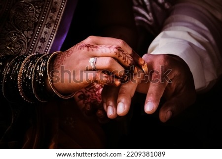 Indian traditional ring ceremony of couples, putting rings. Royalty-Free Stock Photo #2209381089