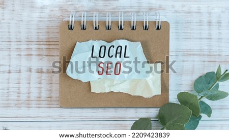 Handwriting text writing Local Seo wooden table. Concept meaning incredibly effective way to market your near business online.