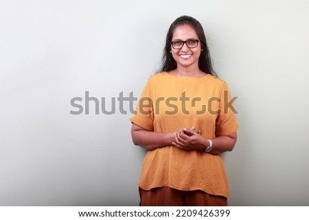 Portrait of a woman of Indian ethnicity with a smiling face Royalty-Free Stock Photo #2209426399