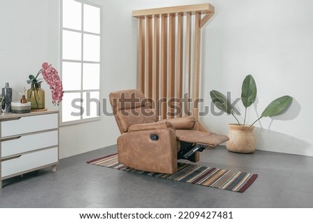 Comfortable Modern Recliner Sofa on Minimalist and Modern Home Royalty-Free Stock Photo #2209427481