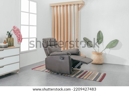 Comfortable Modern Recliner Sofa on Minimalist and Modern Home Royalty-Free Stock Photo #2209427483