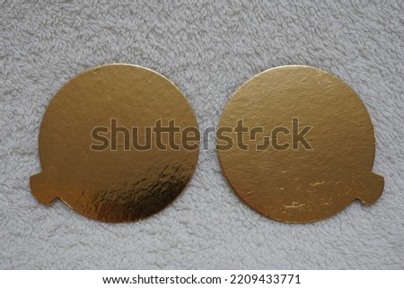 Two golden speech bubbles on a textured white background.