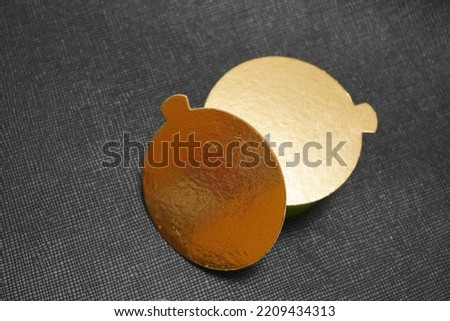 Two golden speech bubbles on a textured black background.