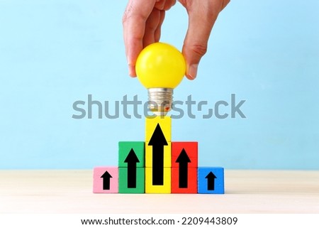 Education and business concept image. Creative idea and innovation. light bulb metaphor and arrows over blue background