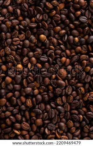 High roast coffee beans structured and textured background