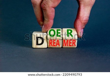 Doer or dreamer symbol. Concept words Doer or dreamer on wooden cubes. Businessman hand. Beautiful grey table grey background. Business and doer or dreamer concept. Copy space. Royalty-Free Stock Photo #2209490793