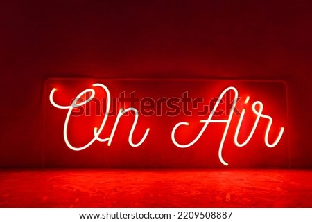 Red neon sign on air. Trendy style. Neon sign. Custom neon. Home decor.