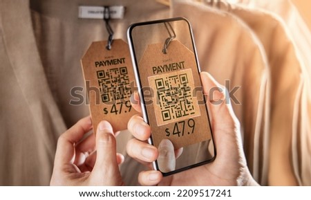Customer making Payment via Mobile Phone. Wireless, Contactless and Touchless Technology in Business Concepts. Using Mobile Phone to Scan on Tag for Payment. Closeup shot. 
