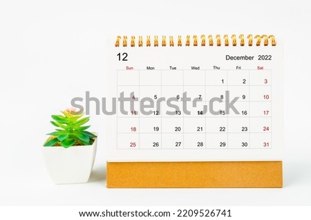December 2022 Monthly desk calendar for 2022 year with plant pot isolated on white background. Royalty-Free Stock Photo #2209526741