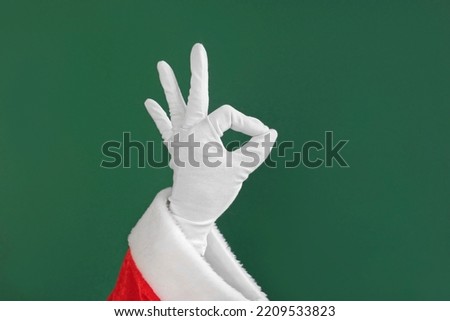 Santa Claus Hands Making Victory Sign and OK Gesture Isolated On Green Background. Close Up. Christmas Congratulation. Chroma Key Screen. Everything is Good. Proposing product. Gestures Pack