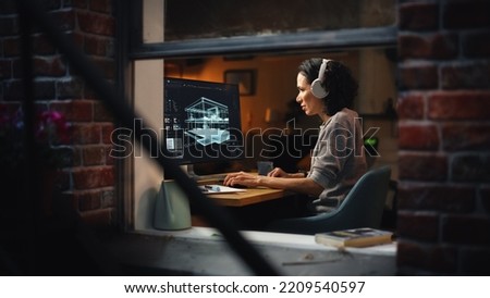 Creative Female 3D Architect Artist Using Desktop Computer with Screen Showing CAD Real Estate Project. Brazilian Woman Video Game Developer Creating Gaming Level. View Into the Apartment Window. Royalty-Free Stock Photo #2209540597