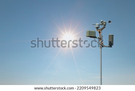Weather station automatic measurement of weather parameters with Clear sky and sun Royalty-Free Stock Photo #2209549823