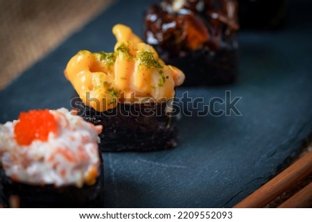 Sushi is a Japanese dish of prepared vinegared rice (鮨飯, sushi-meshi), usually with some sugar and salt, accompanied by a variety of ingredients