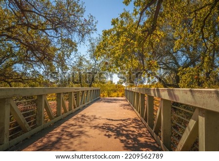 Old bridge over the creek on Sacramento River Trail in Redding,  California  Royalty-Free Stock Photo #2209562789