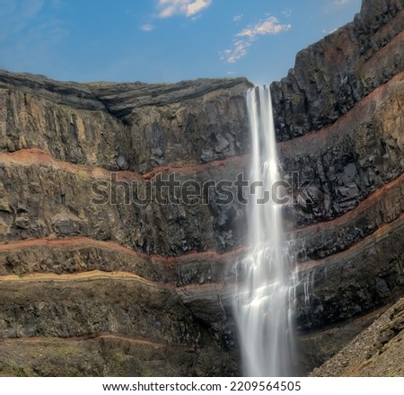 Hengifoss, 128 meters, in Fljótsdalshreppur, East Iceland. Surrounded by basaltic strata interspaced by clay layers.