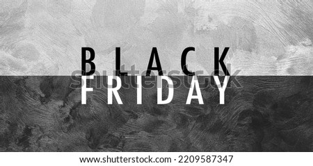 Black Friday concept, text on background of textured monochrome wall. Panoramic banner view.