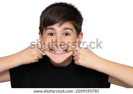 A 9-year-old boy in a black t-shirt on a white background and depicts a monkey