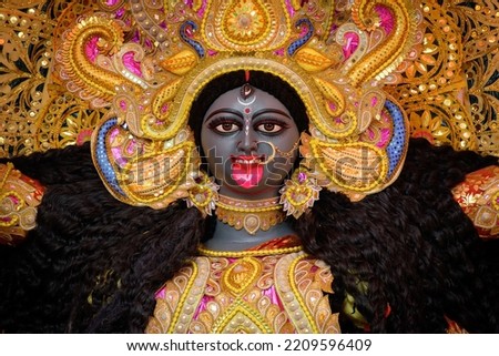Idol of Goddess Maa Kali at a decorated puja pandal in Kolkata, West Bengal, India. Kali puja also known as Shyama Puja is a famous religious festival of Hinduism. Royalty-Free Stock Photo #2209596409