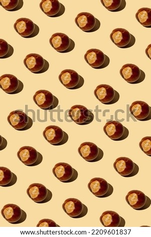minimal pattern composition of 
chestnut on bright brown background.
