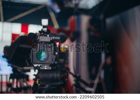 Professional film and video camera on the set. Shooting shift, equipment and group. Modern photography technique.