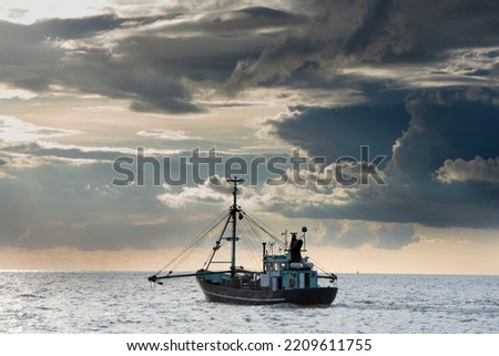 Fishing of gray northsea shrimps near the coast Royalty-Free Stock Photo #2209611755